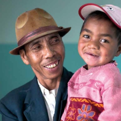 A man carries a child