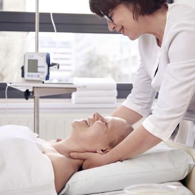 A person looks after a patient